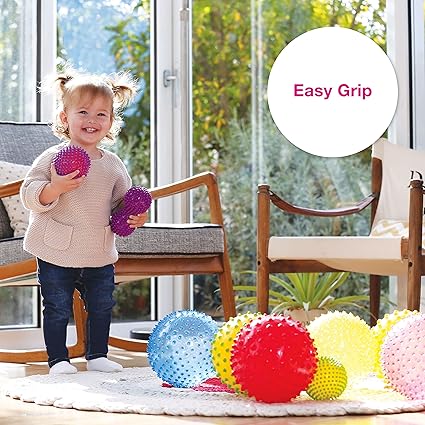 The toddler with the huge smile on her face grabe the Edushape sensory ball.Best sensory toy for babies and toddlers having Autism and ADHD.