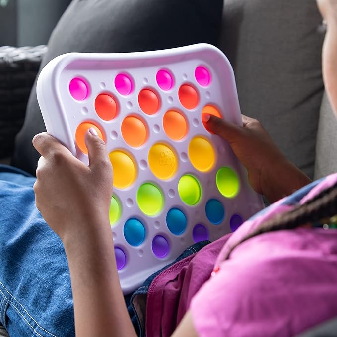 The child is holding a fat brain toy dipl .Best for predictable sensory input for your babies and toddlers that help them to calm.
